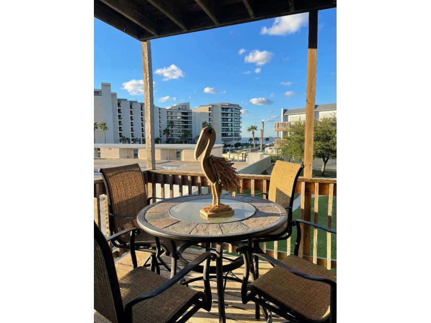 Sit on the deck and watch the ships pass by while drinking a - Beach Vacation Rentals in Port Aransas, Texas on Beachhouse.com