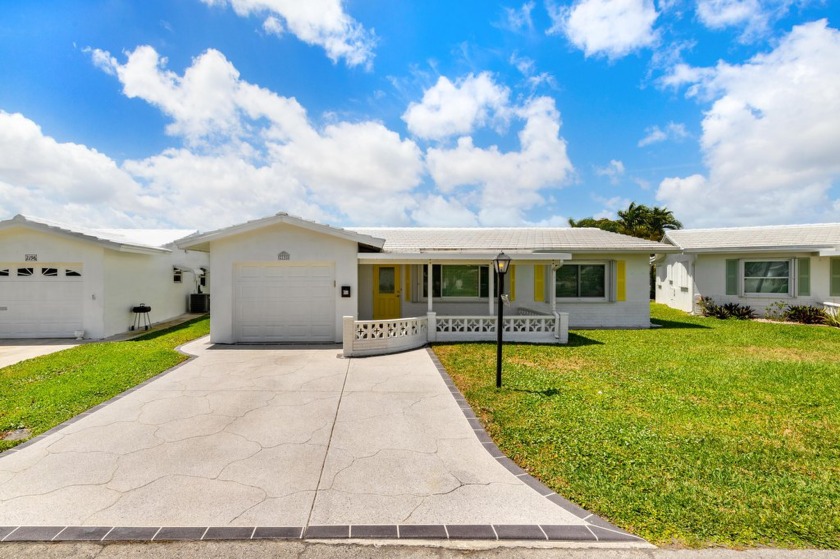 Nestled within 55+ Palm Beach Leisureville, this expanded - Beach Home for sale in Boynton Beach, Florida on Beachhouse.com