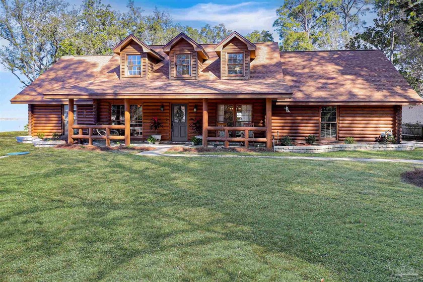 Waterfront log cabin on East Bay in Gulf Breeze offering rare - Beach Home for sale in Gulf Breeze, Florida on Beachhouse.com