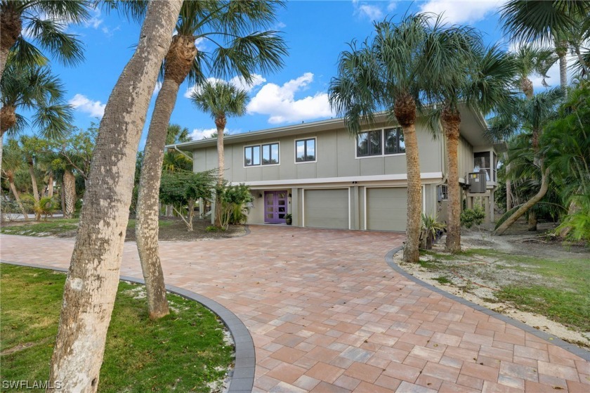 This serene home, set back several hundred feet from the road - Beach Home for sale in Sanibel, Florida on Beachhouse.com