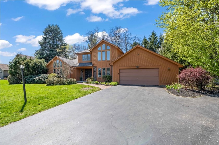 Tucked on a quiet street in the Webster School District, this - Beach Home for sale in Webster, New York on Beachhouse.com