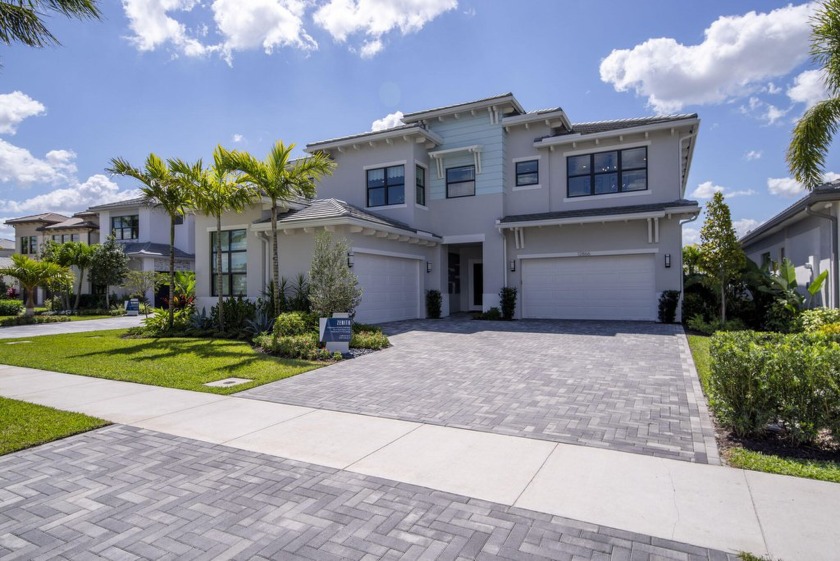 Discover the pinnacle of style in this newly constructed 5,260 - Beach Home for sale in Palm Beach Gardens, Florida on Beachhouse.com