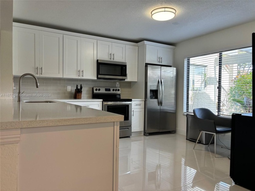 GORGEOS COMPLETELY RENOVETED ground floor 2 bed 2 bath. Brand - Beach Condo for sale in Boynton Beach, Florida on Beachhouse.com