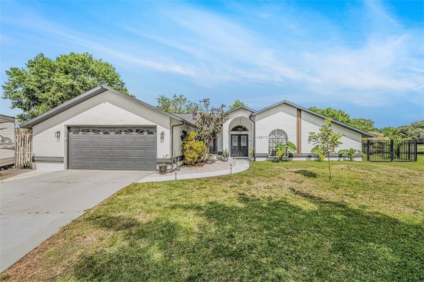 Tucked away on a peaceful cul-de-sac, this beautifully updated - Beach Home for sale in Hudson, Florida on Beachhouse.com