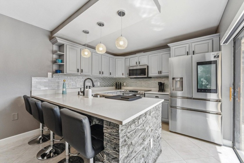 Embrace this beautifully renovated home, that features a - Beach Townhome/Townhouse for sale in West Palm Beach, Florida on Beachhouse.com