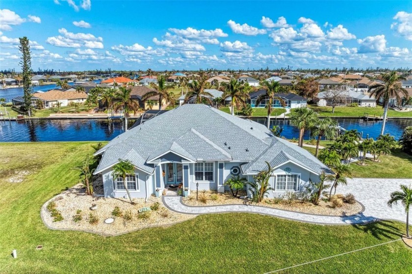 Nestled on a spacious double lot, this stunning waterfront home - Beach Home for sale in Port Charlotte, Florida on Beachhouse.com