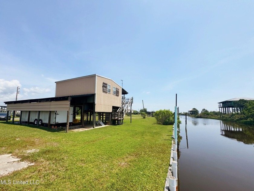 This charming waterfront camp is located in a quiet community - Beach Home for sale in Bay Saint Louis, Mississippi on Beachhouse.com