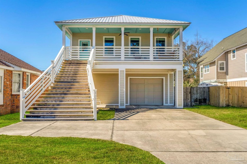 Experience coastal living at its finest with waterfront views of - Beach Home for sale in Pensacola, Florida on Beachhouse.com