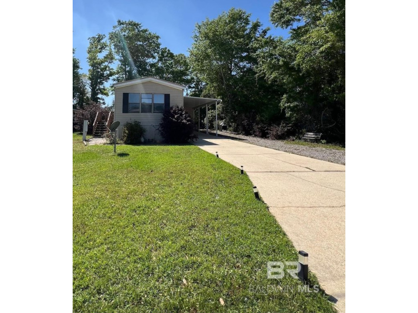 Nestled in a quiet section of the Spanish Cove neighborhood with - Beach Home for sale in Lillian, Alabama on Beachhouse.com