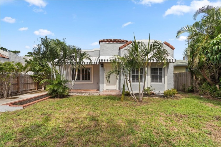 Nestled in the vibrant city of West Palm Beach, this spacious - Beach Home for sale in West Palm Beach, Florida on Beachhouse.com