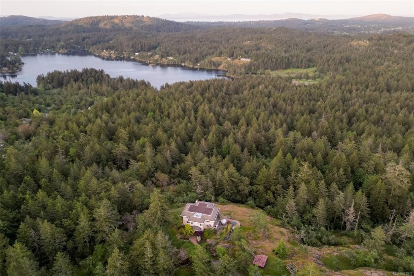 Enter this timeless manor home nestled within a 10-acre private - Beach Home for sale in Saanich,  on Beachhouse.com