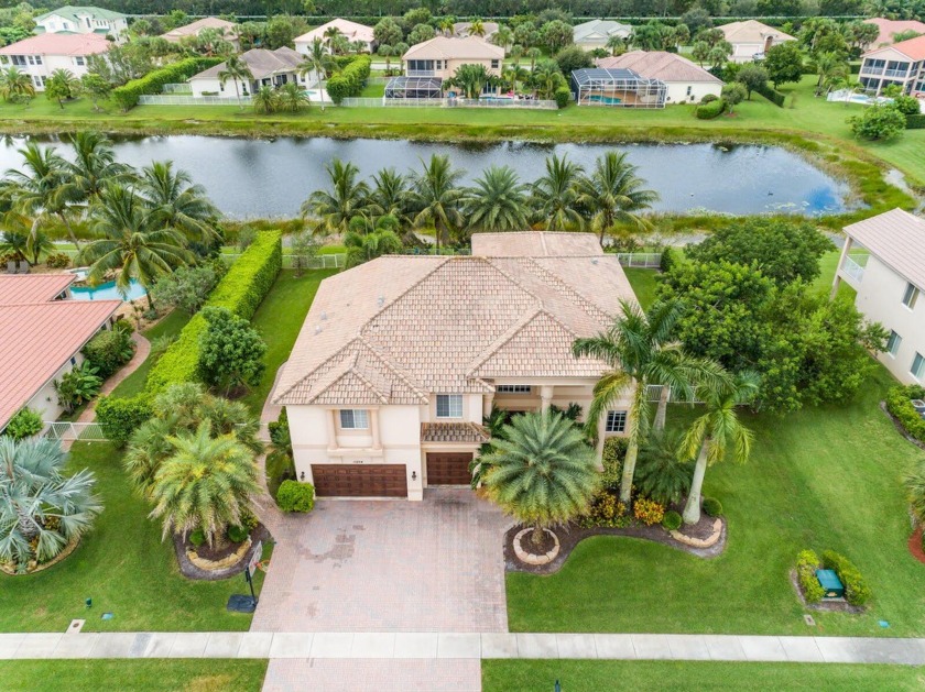Towering palm trees entice you inside to discover an - Beach Home for sale in Wellington, Florida on Beachhouse.com