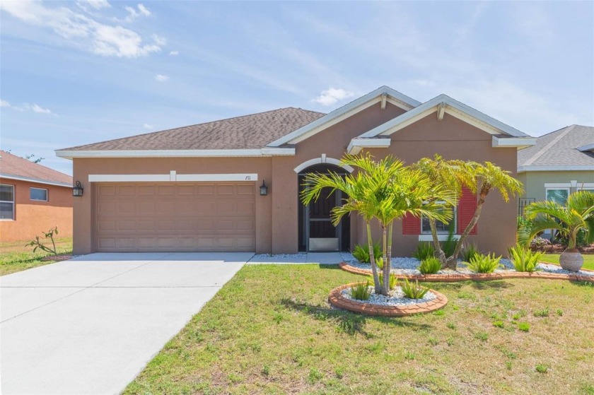 POOL home! Situated on a peaceful LAKE FRONT LOT, welcome to - Beach Home for sale in Ruskin, Florida on Beachhouse.com