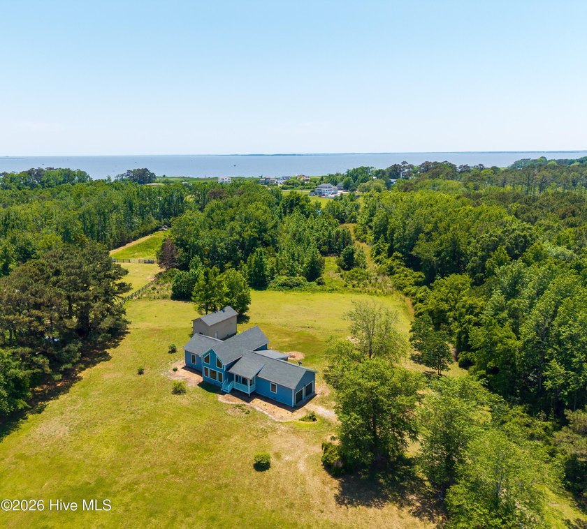Situated on approximately 4.9 acres in Knotts Island, NC, this - Beach Home for sale in Knotts Island, North Carolina on Beachhouse.com