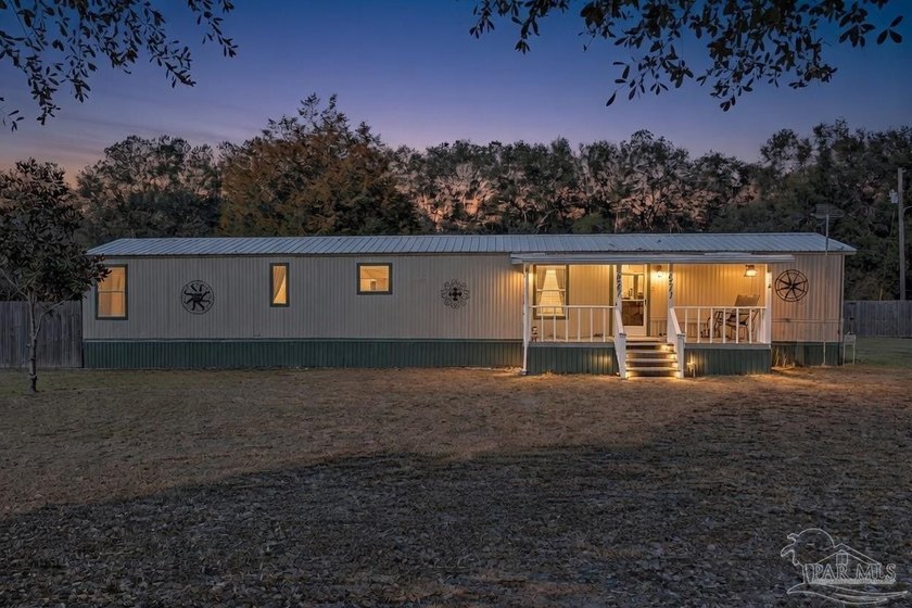 This residence sits on one full acre in the highly desired - Beach Home for sale in Pace, Florida on Beachhouse.com