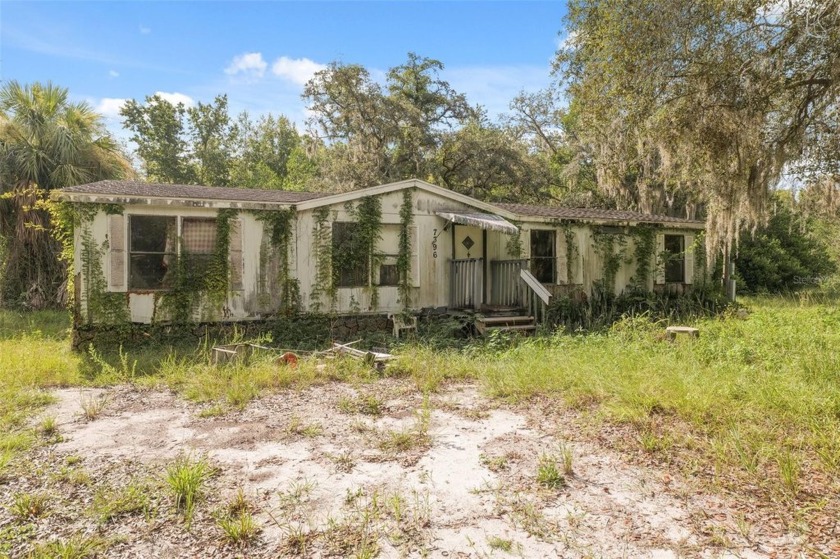 Under contract-accepting backup offers. Situated on a spacious - Beach Home for sale in Weeki Wachee, Florida on Beachhouse.com