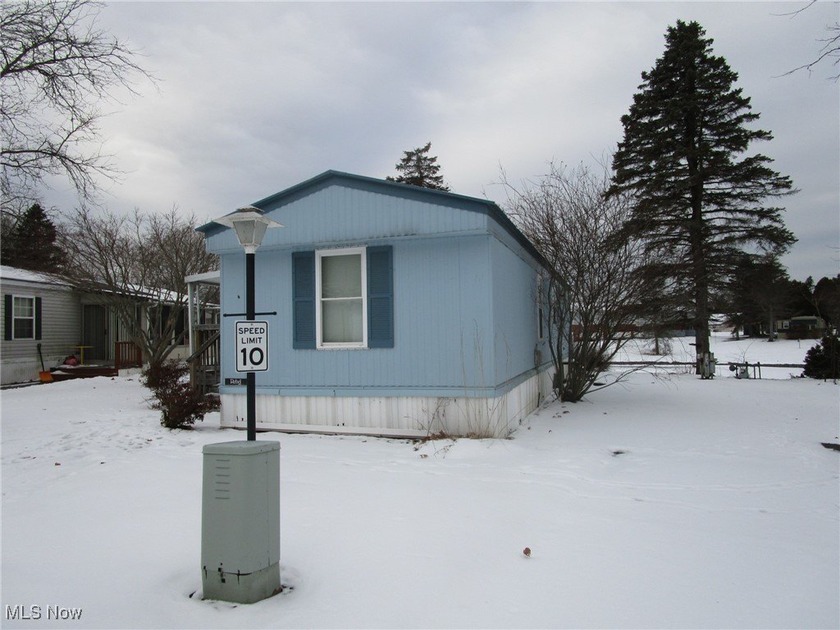 Enjoy easy one floor living with peaceful views of a sunlit pond - Beach Home for sale in Ashtabula, Ohio on Beachhouse.com