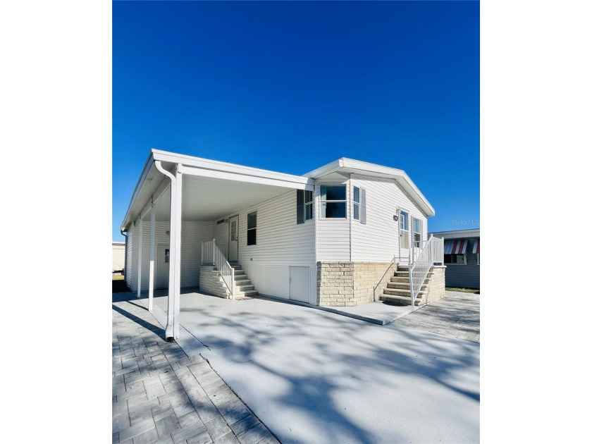 Ideally located just across the street from Sarasota Bay, this - Beach Home for sale in Bradenton, Florida on Beachhouse.com