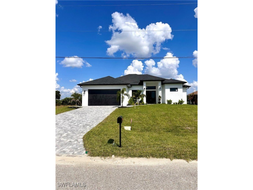 Step into this stunning newly constructed home, completed in - Beach Home for sale in Cape Coral, Florida on Beachhouse.com