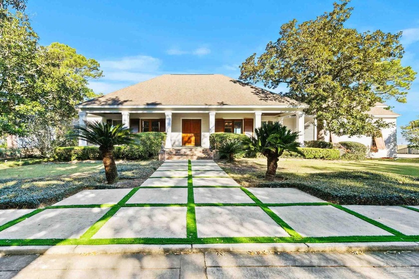 Tucked beneath a canopy of magnificent, centruies-old oaks, this - Beach Home for sale in Gulf Shores, Alabama on Beachhouse.com