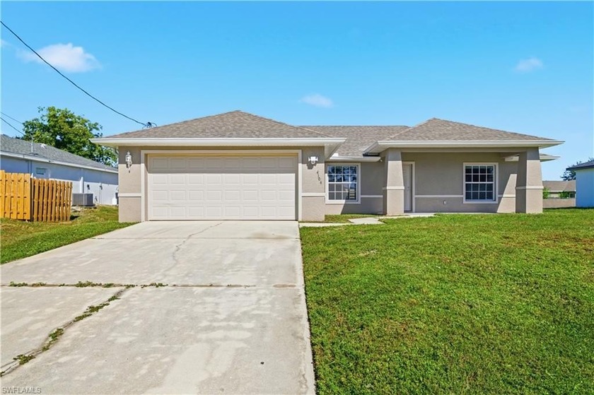 This beautifully maintained 3-bedroom, 2-bath home sits on a - Beach Home for sale in Lehigh Acres, Florida on Beachhouse.com