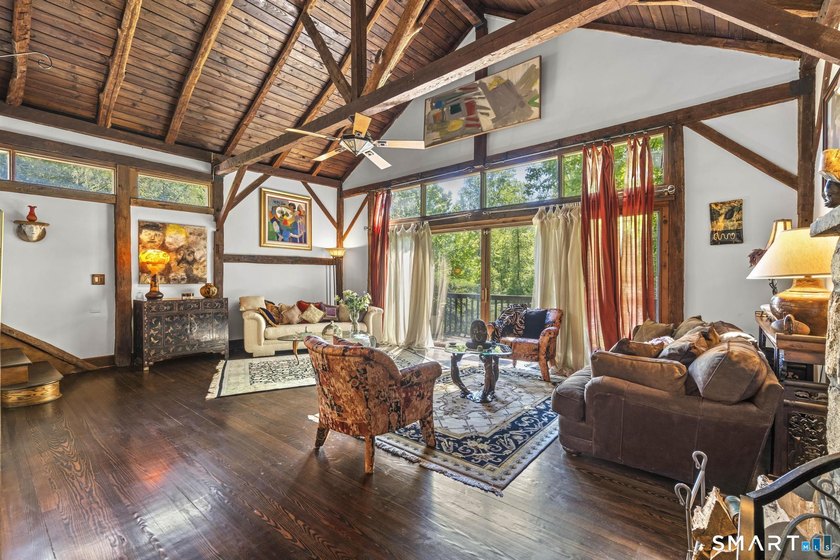 Quietly set back from the road on a private, wooded acre, this c - Beach Home for sale in Stamford, Connecticut on Beachhouse.com