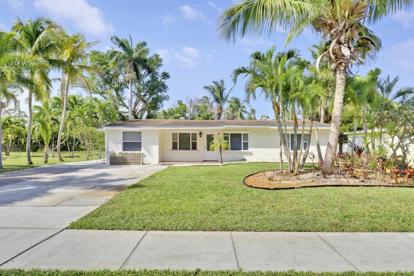 Welcome to this charming 3-bedroom, 2-bathroom home in the heart - Beach Home for sale in West Palm Beach, Florida on Beachhouse.com