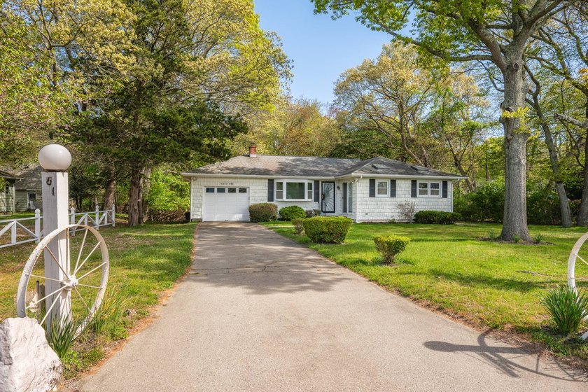 Tucked away on a shy half-acre backing directly onto peaceful - Beach Home for sale in Southampton, New York on Beachhouse.com