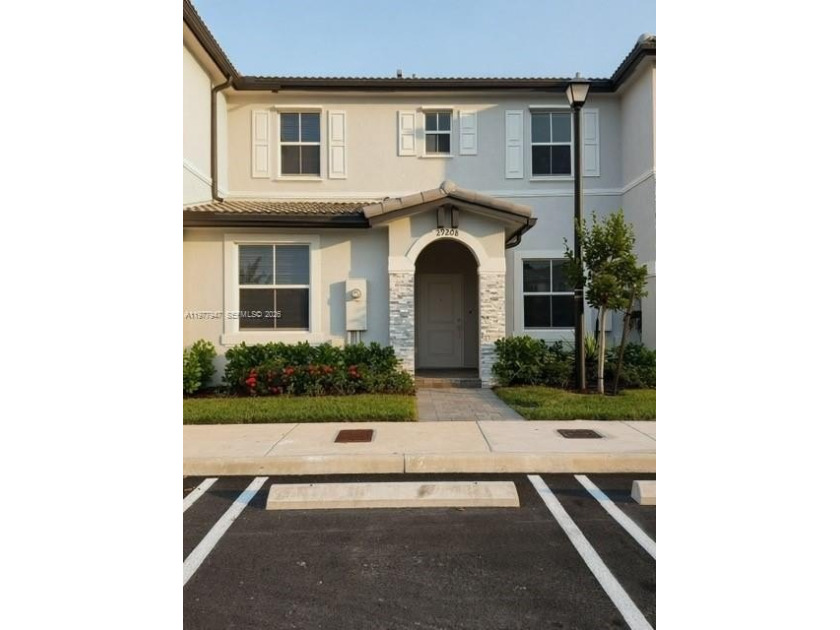 This beautiful, never-lived-in home located in a highly - Beach Townhome/Townhouse for sale in Homestead, Florida on Beachhouse.com