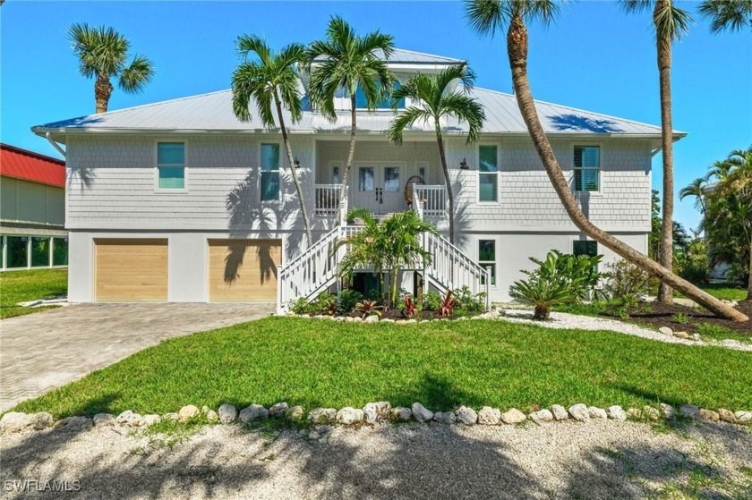 Along the Sanibel River with gorgeous wide water views and green - Beach Home for sale in Sanibel, Florida on Beachhouse.com