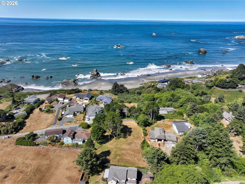 GATED FLAT .65 AC LOT WITH BEAUTIFUL OCEAN VIEW. This lot is NOT - Beach Lot for sale in Brookings, Oregon on Beachhouse.com