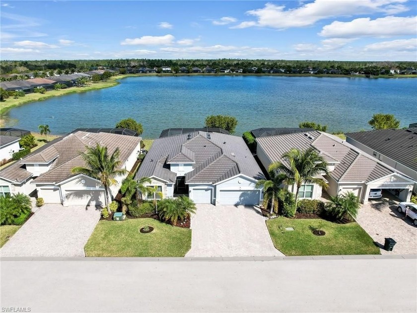 LAKESIDE POOL, SUNSETS, SUNRISES, and a 3 CAR GARAGE!! This 6 - Beach Home for sale in Bonita Springs, Florida on Beachhouse.com
