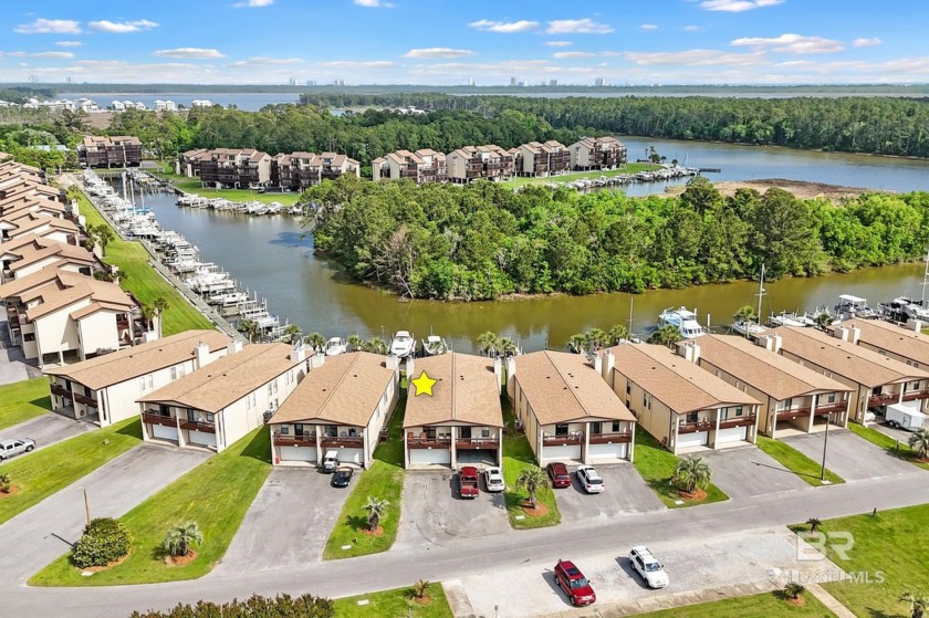 Coastal living meets a boaters paradise!! Tucked away in the - Beach Home for sale in Gulf Shores, Alabama on Beachhouse.com