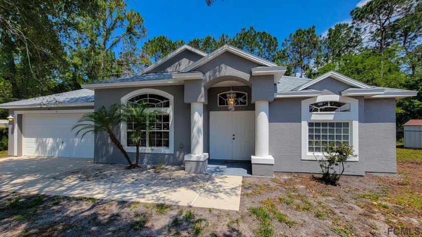 This spacious 3BR/2BA home is tucked away on a cul-de-sac in the - Beach Home for sale in Palm Coast, Florida on Beachhouse.com