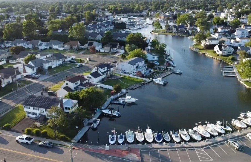 Wow!! Welcome to your waterfront oasis! Nestled on a serene - Beach Home for sale in Copiague, New York on Beachhouse.com