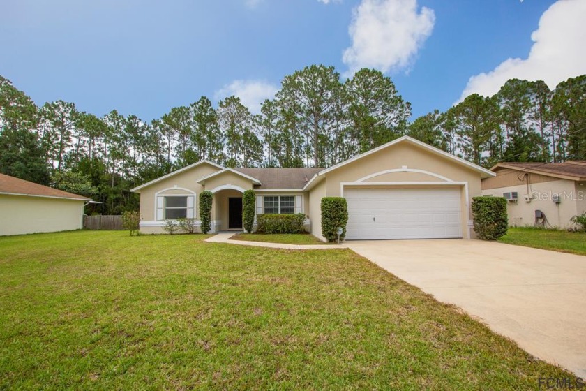 Lovely, clean and well-kept split-plan home in great area of - Beach Home for sale in Palm Coast, Florida on Beachhouse.com