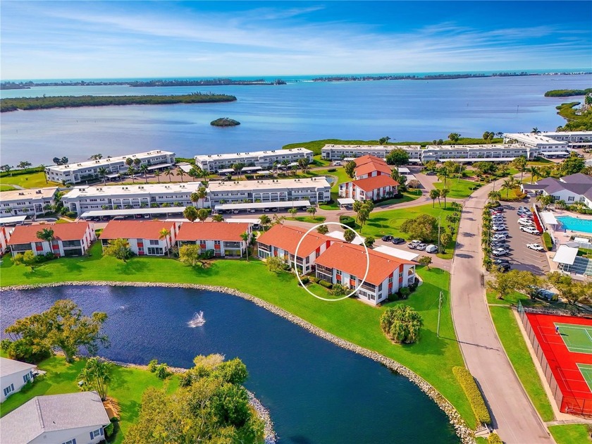 WELCOME TO THIS EXCEPTIONAL LAKEFRONT CORNER CONDO located in - Beach Condo for sale in Bradenton, Florida on Beachhouse.com
