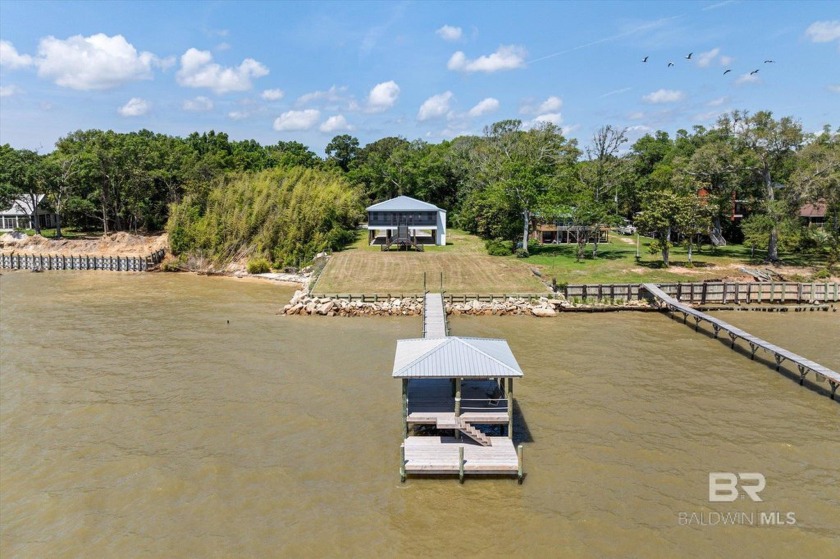 Discover coastal luxury at its finest in this brand-new, Gold - Beach Home for sale in Coden, Alabama on Beachhouse.com