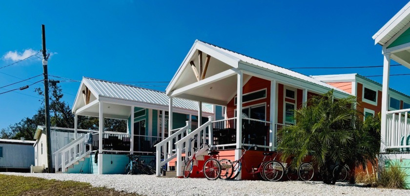 A spacious deck leads into the welcoming living room, kitchen - Beach Home for sale in Sarasota, Florida on Beachhouse.com