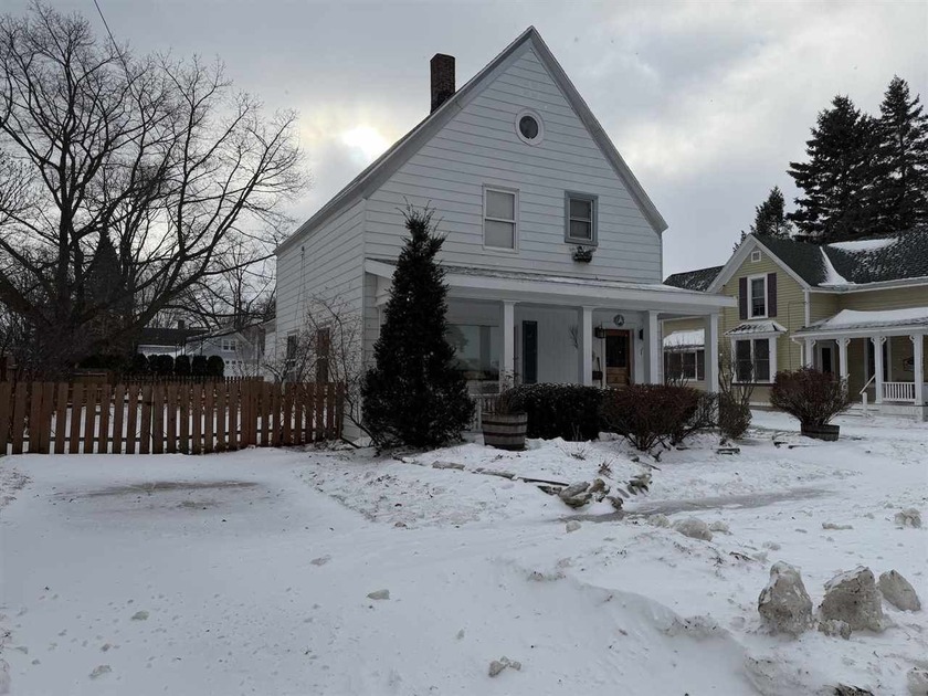 Location! Location! Tucked into the heart of downtown Charlevoix - Beach Home for sale in Charlevoix, Michigan on Beachhouse.com