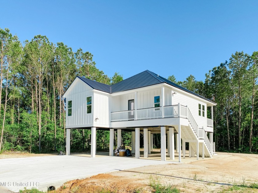 This stunning newly built residence boasts an excellent - Beach Home for sale in Waveland, Mississippi on Beachhouse.com