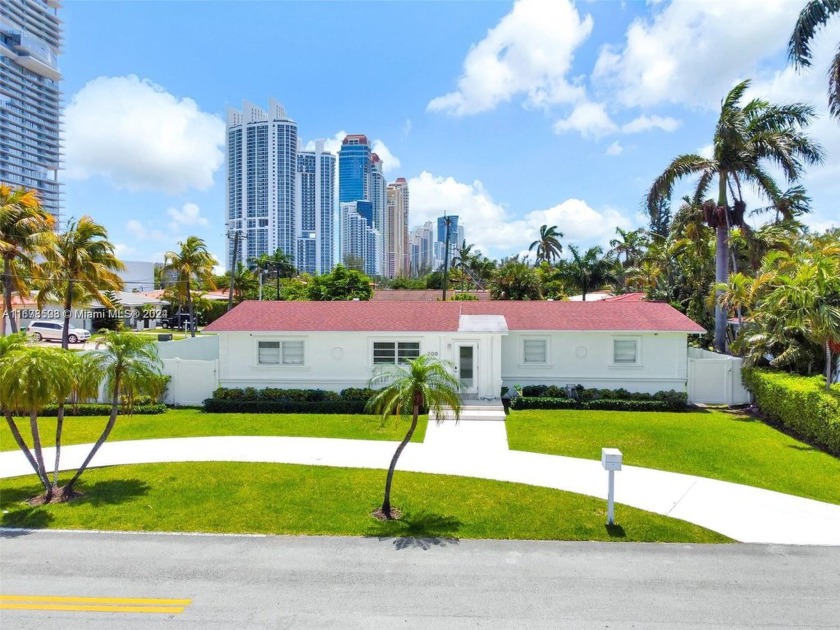 Prime corner lot just steps from the beach, featuring a generous - Beach Home for sale in Sunny Isles Beach, Florida on Beachhouse.com