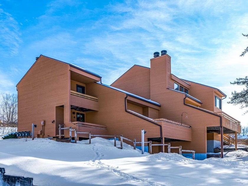 This beautifully positioned three-level end-unit Trout Creek - Beach Condo for sale in Harbor Springs, Michigan on Beachhouse.com