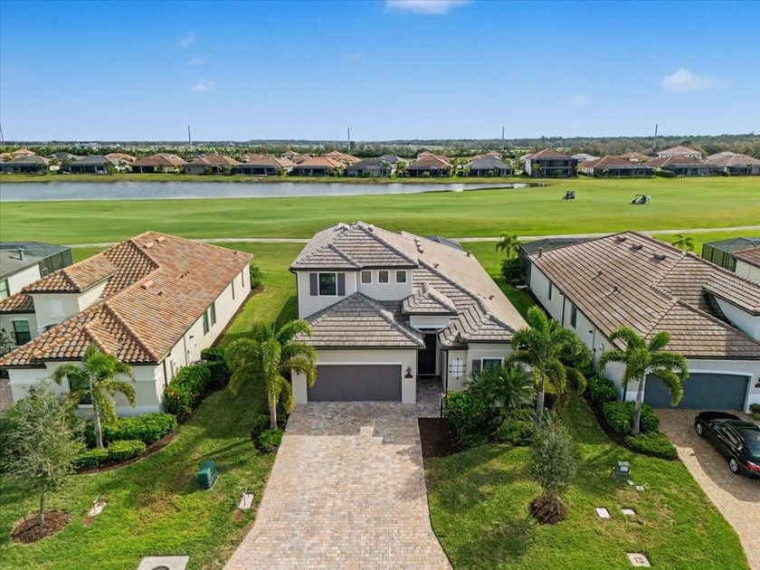 Golf, water, and sunrise views with true backyard privacy! Built - Beach Home for sale in Lakewood Ranch, Florida on Beachhouse.com