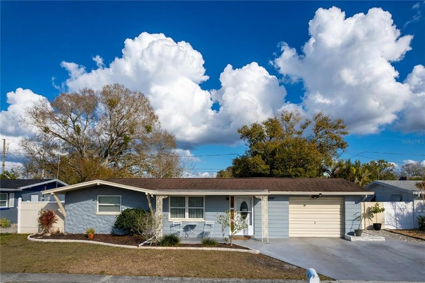 Located in a quiet Holiday neighborhood East of US-19, this - Beach Home for sale in Holiday, Florida on Beachhouse.com