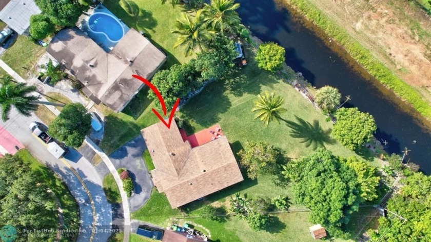 Discover a unique waterfront gem: 4/2 1 car garage on over 1/3 - Beach Home for sale in Sunrise, Florida on Beachhouse.com