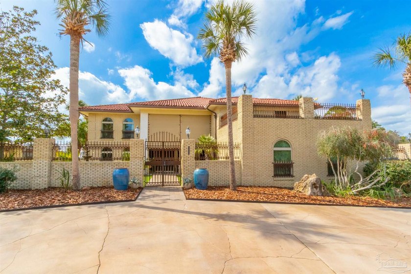 Welcome to this large 5-bedroom, 5-bath Mediterranean-style - Beach Home for sale in Pensacola, Florida on Beachhouse.com