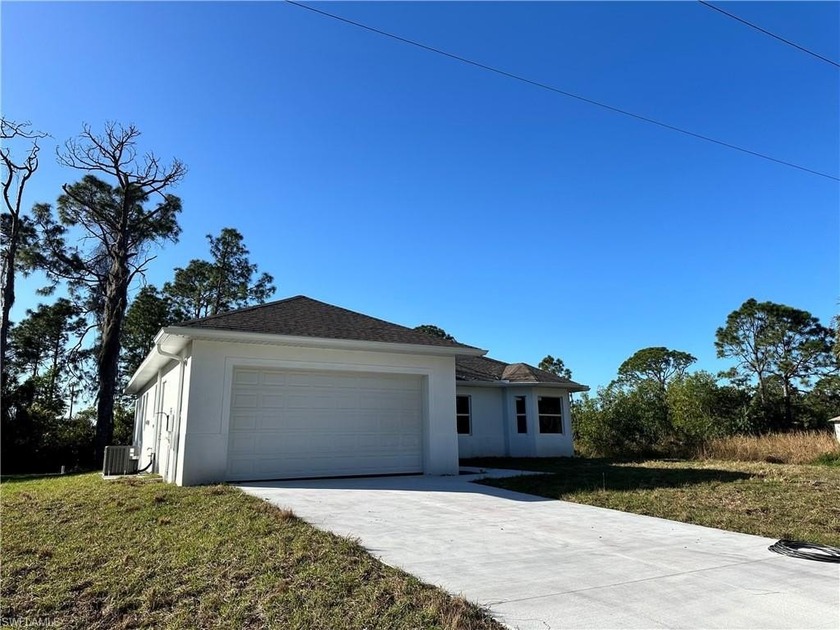 Step into comfort and style at 718 Chattman St E! NEW - Beach Home for sale in Lehigh Acres, Florida on Beachhouse.com