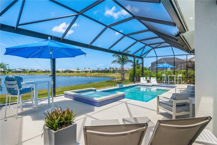 Timeless 2022-built pool home that overlooks the tranquil lake - Beach Home for sale in Vero Beach, Florida on Beachhouse.com