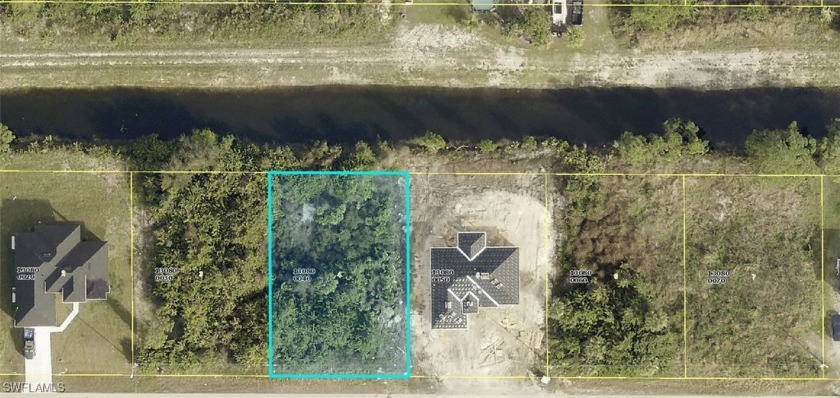 This 1/4-acre lot offers scenic canal views and is situated in - Beach Lot for sale in Lehigh Acres, Florida on Beachhouse.com